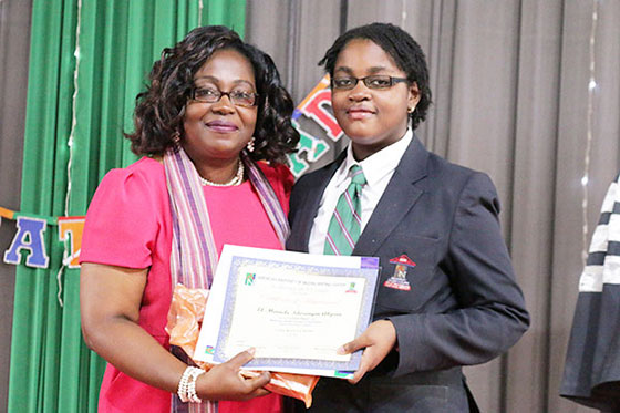 Director AUN Writing Center, Ms. Emilienne Akpan, Presenting the First Place Award for the Academy’s Writing Competition to El-Miracle Idorenyin Akpan Director AUN Writing Center, Ms. Emilienne Akpan, Presenting the First Place Award for the Academy’s Writing Competition to El-Miracle Idorenyin Akpan